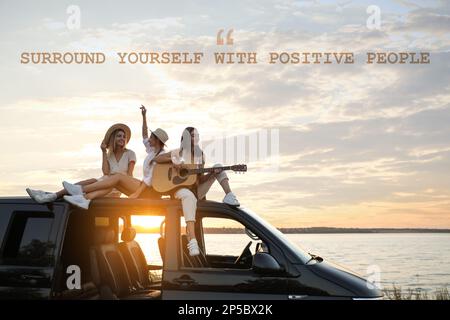 Surround Yourself With Positive People. Inspirational quote reminding that good company will make your life better. Text against view of friends havin Stock Photo