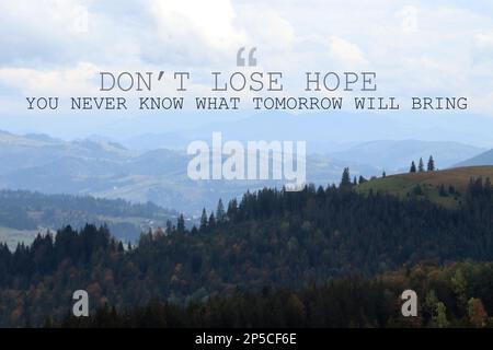 Don't Lose Hope You Never Know What Tomorrow Will Bring. Inspirational quote saying about patience, belief in yourself and next day. Text against beau Stock Photo