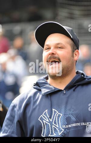 New York Yankees pitcher Joba Chamberlain is shown with his two