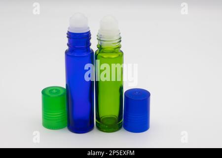 Empty blue and green roll on bottles Stock Photo