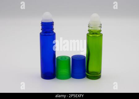 Empty blue and green roll on bottles Stock Photo