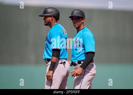 Miami Marlins first base coach Jon Jay (11) talks with Luis Arraez (3)  during a spring training baseball game against the Boston Red Sox on March  5, 2023 at JetBlue Park in Fort Myers, Florida. (Mike Janes/Four Seam  Images via AP Stock Photo - Alamy