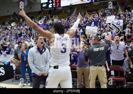 Furman guard Mike Bothwell (3) dunks a basket over Chattanooga guard Jamal  Johnson (5), Chattanooga guard Randy Brady (34) and Chattanooga guard  Demetrius Davis (22) as Furman forward Ben VanderWal (4) celebrates