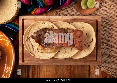 Carne Asada. (roast meat) very popular dish in northern Mexico, also called Asado, Discada or Parrillada, is a cooking technique in which food is expo Stock Photo