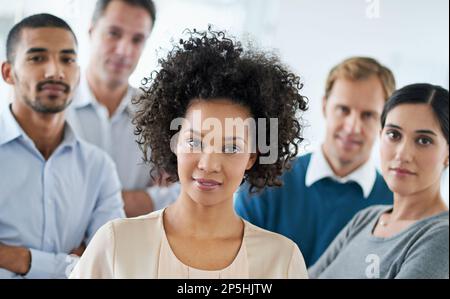 Were the team you need. Portrait of a group of diverse colleagues standing in an office. Stock Photo