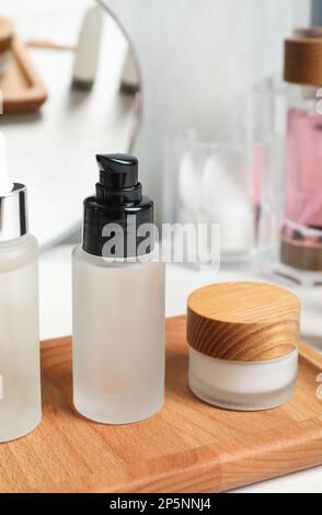 Different cosmetic products on white wooden table Stock Photo