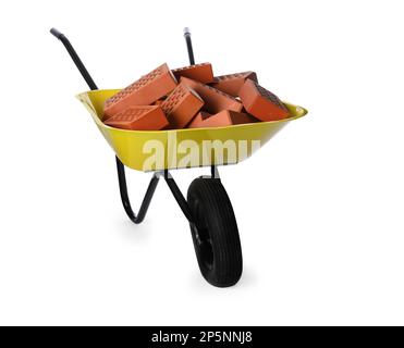 Pile of red bricks in wheelbarrow on white background. Building material Stock Photo