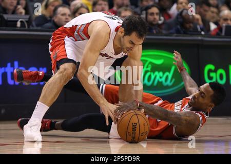 Toronto Raptors Jose Calderon, right steals the ball from New York Knicks  shooting guard Jeremy Lin, left, during first half action at the Air Canada  Centre, in Toronto, Canada on Tuesday, February