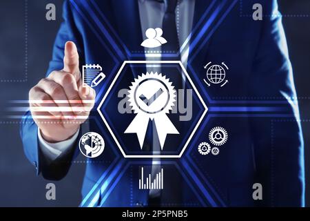 Man pointing at virtual screen with different icons, closeup Stock Photo