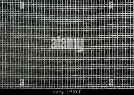 Closeup view of mosquito window screen on grey background Stock Photo