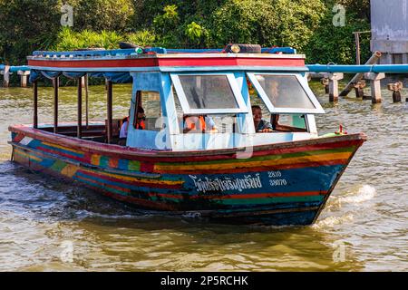 Modified rice barge taking tourists around Taling Chan Floating Market, Bangkok, Thailand Stock Photo