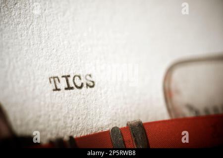 Tics word written with a typewriter. Stock Photo