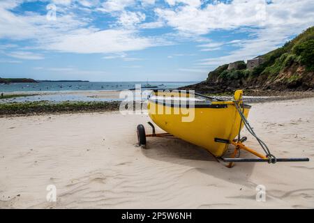 Yellow boat on a beach in Brittany, France Stock Photo