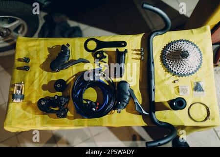 Bike assembling parts custom bicycle in workshop table Stock Photo