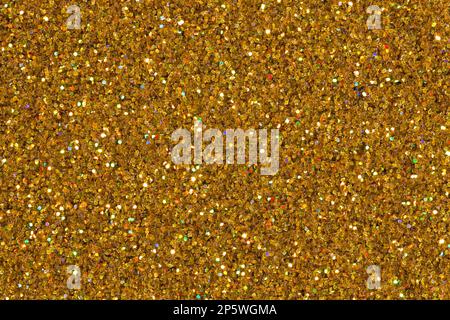 Bronze background glitter with gold for christmas event celebration card design background concept. Shiny light dust sparkle festive decoration Stock Photo