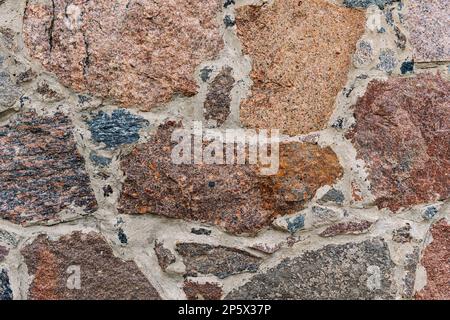Stone wall background texture. Close-up of old building wall Stock Photo