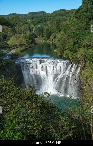 Shifen Waterfall is a scenic waterfall located in the small town of Shifen in Pingxi District, Taiwan. Stock Photo