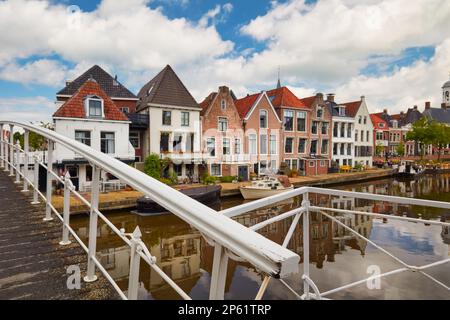 Ancient canal houses and bridge in the city center of Dokkum in Friesland, The Netherlands Stock Photo