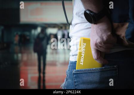 Closeup passports in pocket of jeans at airport. checking documents at the airport Stock Photo