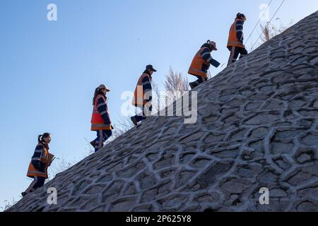 (230307) -- HARBIN, March 7, 2023 (Xinhua) -- Female railway inspectors work in Daqing, northeast China's Heilongjiang Province, March 6, 2023. At the Dorbod railway line maintenance section of China Railway Harbin Bureau Group Co., Ltd., there is a six-member team of female inspectors with an average age of 29. Their responsibilities include maintaining the railway lines for grain and oil transport, as well as 148 kilometers of Binzhou railway line, which is a crucial part of China-Europe rail transport service line. Despite facing challenging conditions, they tackle daily maintenance tasks w Stock Photo