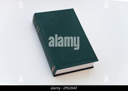 green hardcover book on white background with copy space Stock Photo