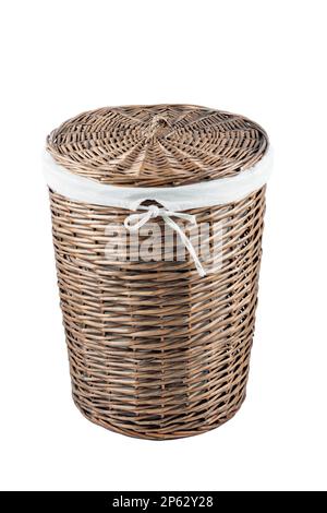 Wicker laundry basket whith closed lid isolated on white background Stock Photo