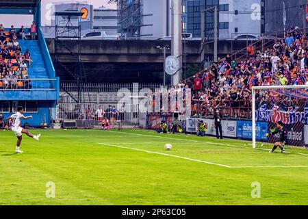 Striker scoring penalty at Thai football match, PAT Stadium, Bangkok Stock Photo