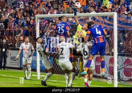 Goalmouth action at Thai football match, PAT Stadium, Bangkok, Thailand Stock Photo