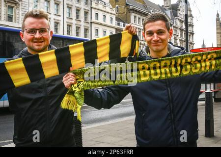 London, UK. 07th Mar, 2023. Borussia Dortmund BVB Fans pose on Whitehall in London with their scarves ahead of for the Uefa Champions Match against Chelsea this evening. Credit: Imageplotter/Alamy Live News Stock Photo