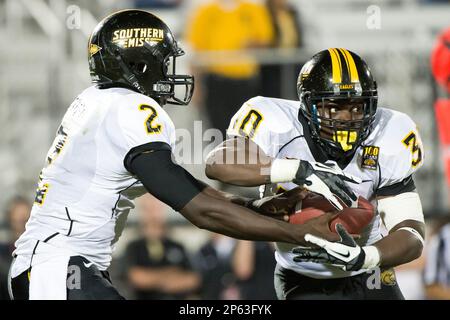 October 13, 2012: Golden Eagles quarterback Anthony Alford (2) hands the  ball off to Golden Eagles running back Jalen Richard (30) during first half  NCAA football between the Southern Miss Golden Eagles