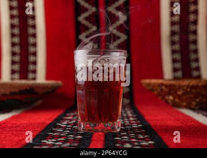 Iconic Arabian fabric is graced with symbols of Arabia, in particular Arabic tea and dates, they symbolise Arabian hospitality, ramadan set Traditiona Stock Photo