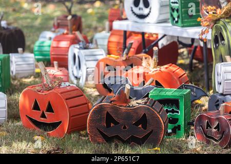 Suwanee, GA / USA - September 18, 2022:  Unique halloween pumpkins made out of wood sit on display at Suwanee Fest, a fall festival. Stock Photo