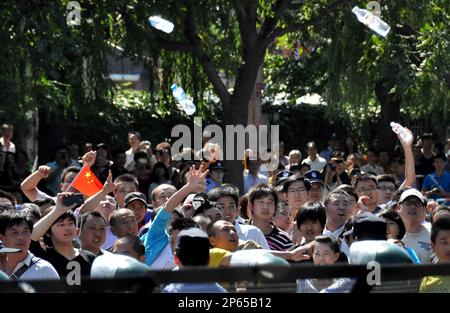 Chinese protestesr throw water bottles at the Japanese Embassy in Beijing on Sept. 17, 2012. Angry anti-Japan demonstrators have marched and staged a rally across China since Japanese government purchased the Senkaku Islands, called Diaoyu in China in the East China Sea. ( The Yomiuri Shimbun via AP Images )