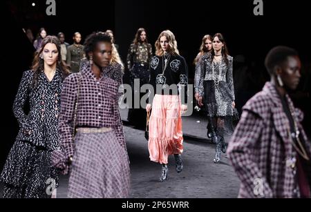 Paris, France. 7th Mar, 2023. Models present creations by French fashion house Chanel as part of its Fall/Winter 2023/2024 pret-a-porter collections during the Paris Fashion Week in Paris, France, March 7, 2023. Credit: Gao Jing/Xinhua/Alamy Live News Stock Photo