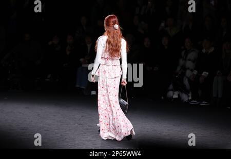 Paris, France. 7th Mar, 2023. A model presents creations by French fashion house Chanel as part of its Fall/Winter 2023/2024 pret-a-porter collections during the Paris Fashion Week in Paris, France, March 7, 2023. Credit: Gao Jing/Xinhua/Alamy Live News Stock Photo