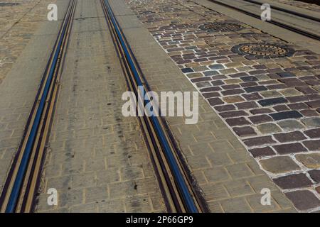Metallic tracks in urban environment for tram. background image. Stock Photo