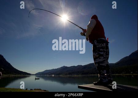 Tony Malacas fishes for silver salmon at the Wayside Park on