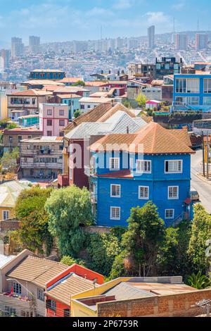 Colorful houses in town on sunny day, Cerro San Juan de Dios, Valparaiso, Chile, South America Stock Photo