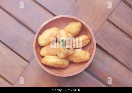 Comro or combro, a traditional Javanese snack made of deep fried grated ...