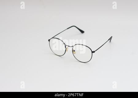 a close up of eyeglasses with black frames isolated on white background Stock Photo