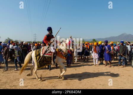 A sikh rides horse during Hola Moholla at Anandpur Sahib in Punjab Stock Photo