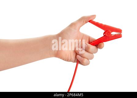 engine jump starter clamp in hand path isolated on white Stock Photo