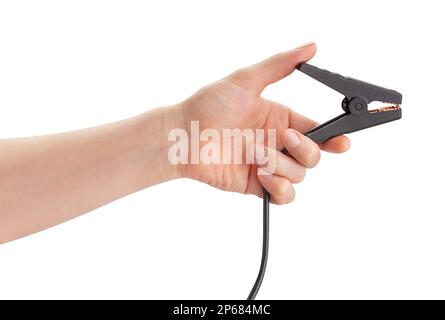 engine jump starter clamp in hand path isolated on white Stock Photo
