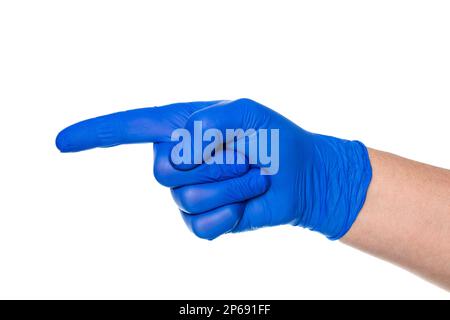 Crop hand of anonymous hand of doctor in latex glove pointing finger away against white background Stock Photo