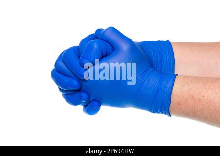 Crop unrecognizable male doctor in blue medical gloves holding hands against white background Stock Photo