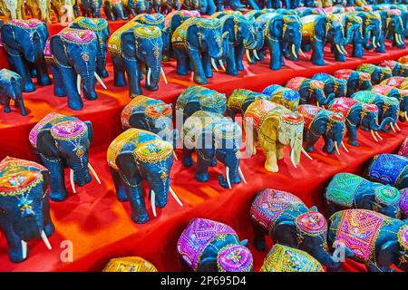 The counter of the Anusarn Night Market stall with handmade carved wooden elephants, decorated with fine patterns, Chiang Mai, Thailand Stock Photo