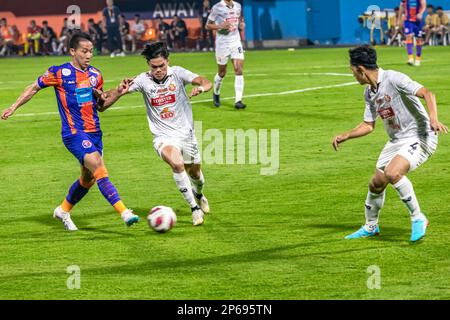 Midfield tackle during Thai premier league game at PAT stadium, Bangkok, Thailand Stock Photo