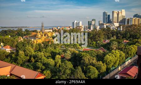 An aerial view in Phnom Penh, Cambodia, showing the elaborate Roral Palace, new high rise buildings, and the Tonle Sap and Mekong rivers. Stock Photo