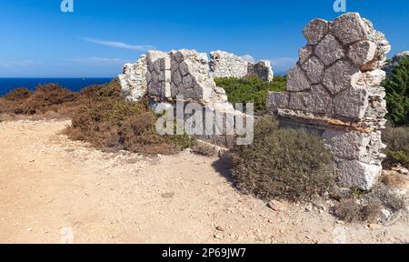 Summer Greek landscape with ruins of abandoned stone house. Greece, Zakynthos island in the Ionian Sea Stock Photo
