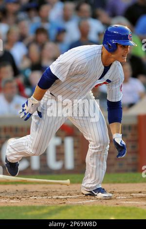 Chicago Cubs first baseman Anthony Rizzo, left, receives a Championship Ring  during a ring ceremony before a baseball game between the Chicago Cubs and  Los Angeles Dodgers at Wrigley Field on April